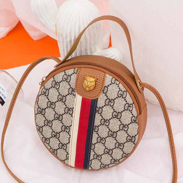 The Merle Round Crossbody